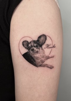 pet dog portrait tattoo on the upper arm
