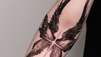 angel wing and star tattoo on the forearm