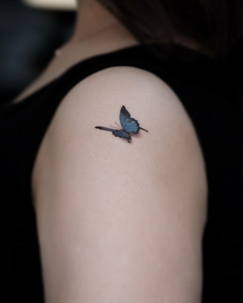 butterfly scar cover up tattoo on the shoulder
