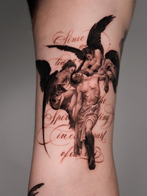 angels and lettering tattoo on the ribs