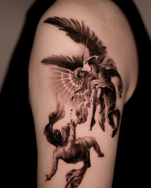 angel tattoo on the upper arm