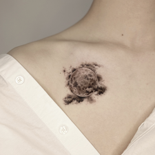 single rose tattoo on the collarbone