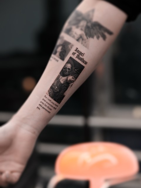 religious patchwork tattoo on the forearm