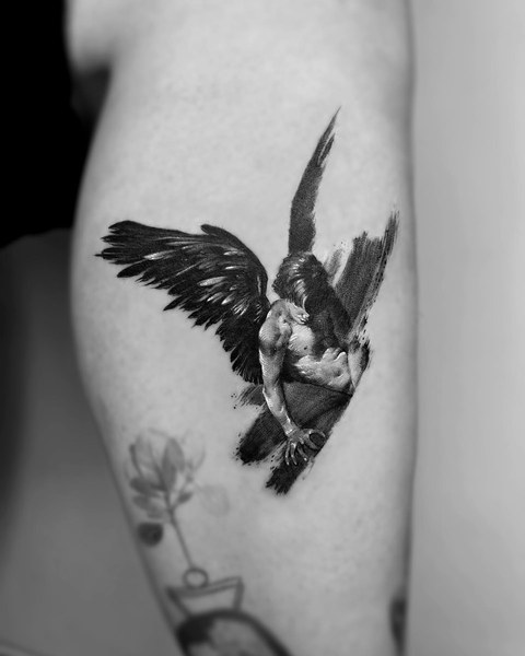 fallen angel tattoo on the calf