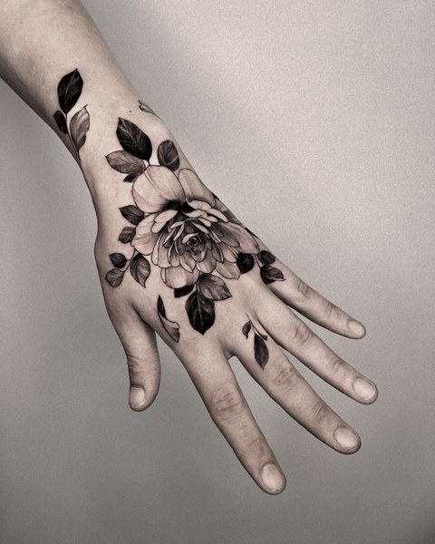 rose tattoo on the back of the hand