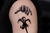 marionette puppet tattoo on the upper arm