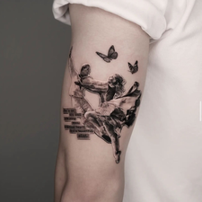 figures and butterflies tattoo above the knee