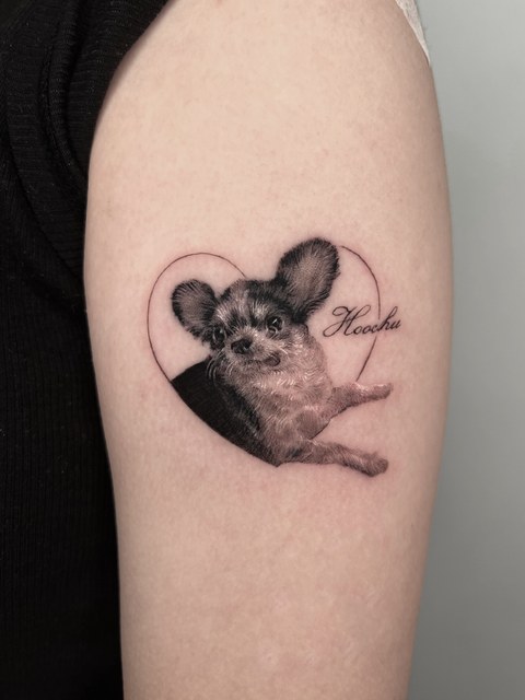 pet dog portrait tattoo on the upper arm